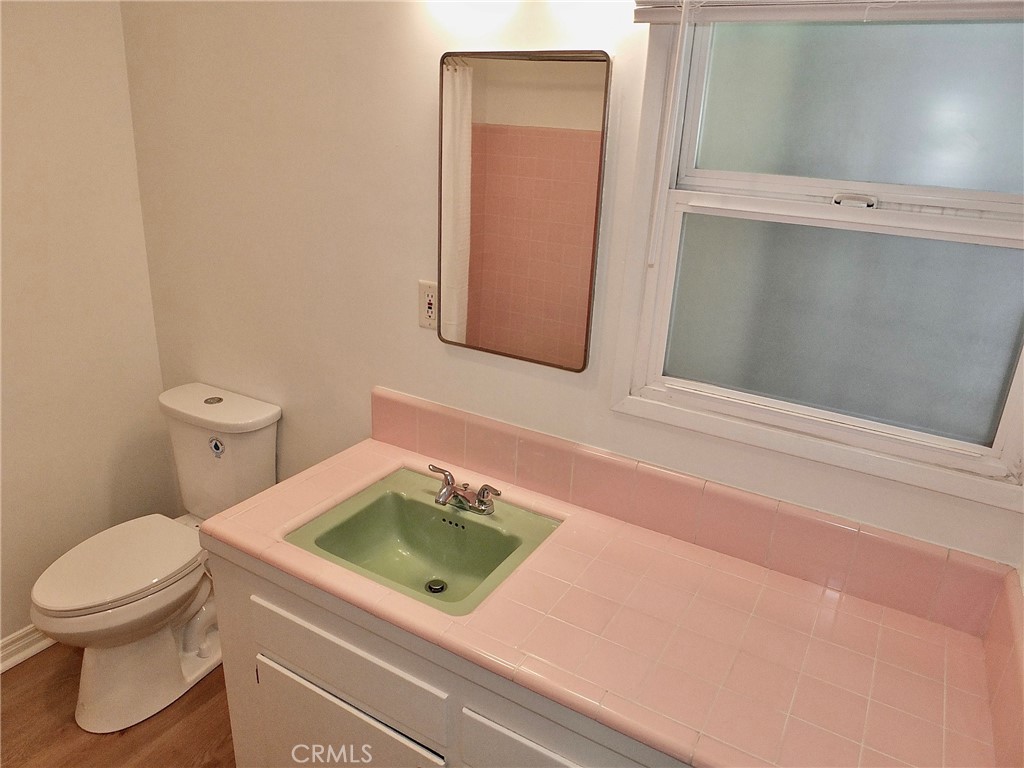 1808 East Appleton Street, Unit 7 Long Beach, CA 90802 - Photo 28 of 44 a bathroom with a toilet and a sink