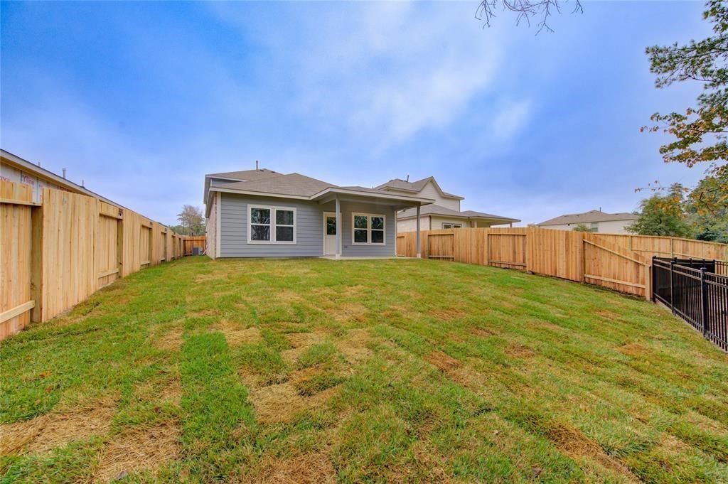 94 Valiant Ridge Trail Magnolia, TX 77354 - Photo 13 of 13 a house view with a garden space