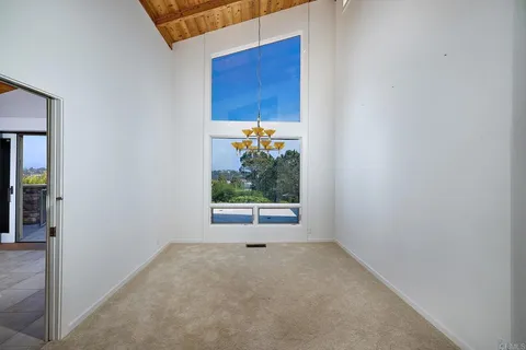 a large bathroom with a large tub and sink