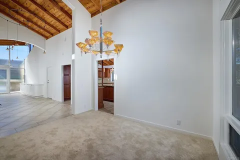 a bathroom with a granite countertop sink a large mirror and a shower