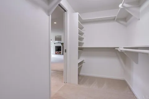 a view of an empty room with a empty shelves