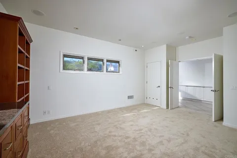 a view of a pathway with a wrought fence