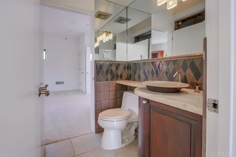 a view of balcony with floor to ceiling windows and garden