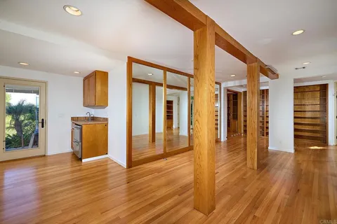 a view of a backyard with plants and a patio