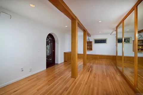 a view of a patio with table and chairs potted plants