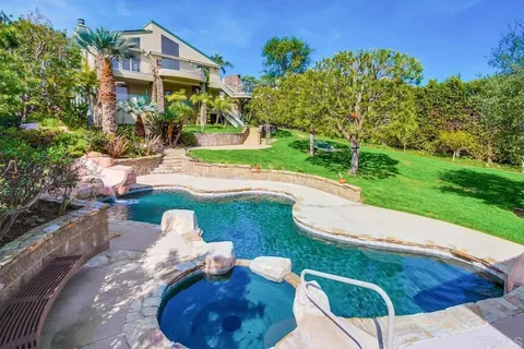 a view of yard with swimming pool