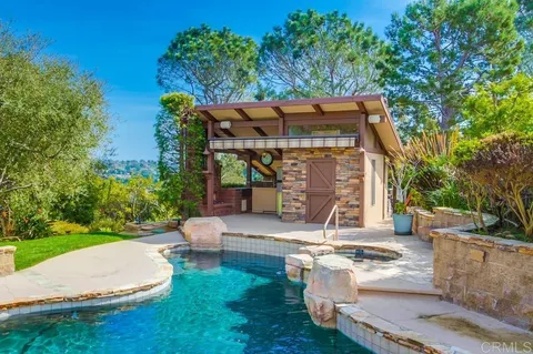 a view of a house with a tree