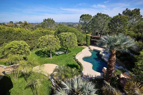 a balcony view with a fireplace and a window