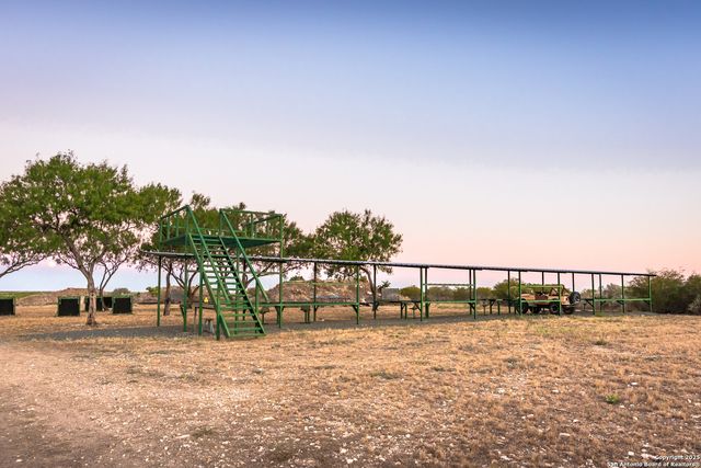 a living room with furniture fireplace and a table