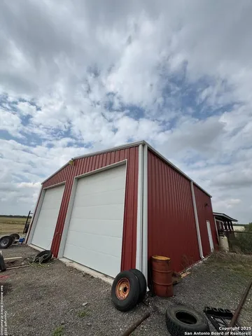 a view of a car park in front of house