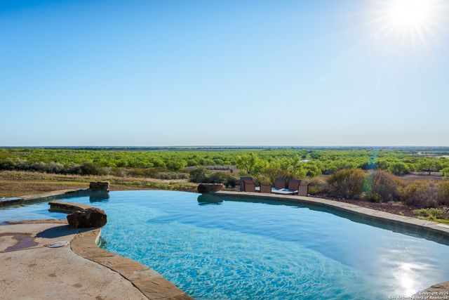 a living room with fireplace furniture and a flat screen tv