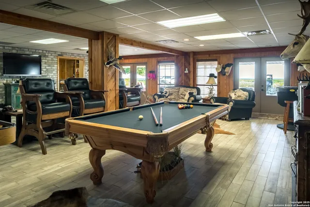 a kitchen with stainless steel appliances granite countertop a refrigerator a sink and a stove