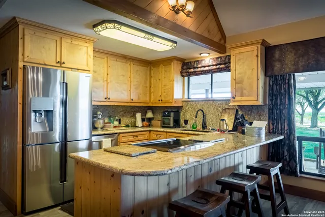 an aerial view of residential building and ocean