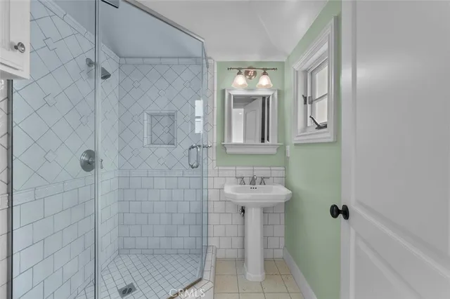 a bathroom with a sink toilet a shower and bathtub