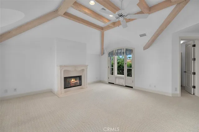 a spacious bathroom with a granite countertop sink a toilet a mirror and shower