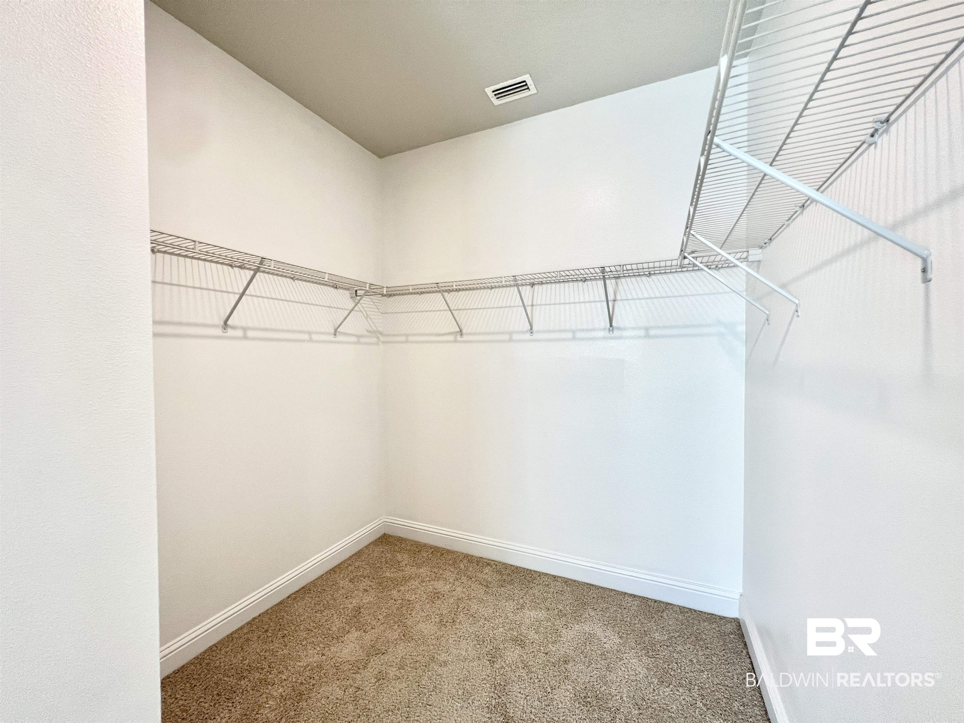 24785 Slater Mill Road Daphne, AL 36526 - Photo 30 of 46 Walk in closet featuring carpet flooring
