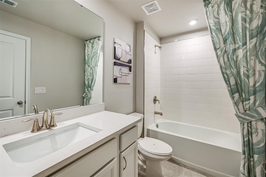 3270 Timber Xing Avenue Brandon, FL 33511 - Photo 15 of 23 a bathroom with a sink toilet and shower