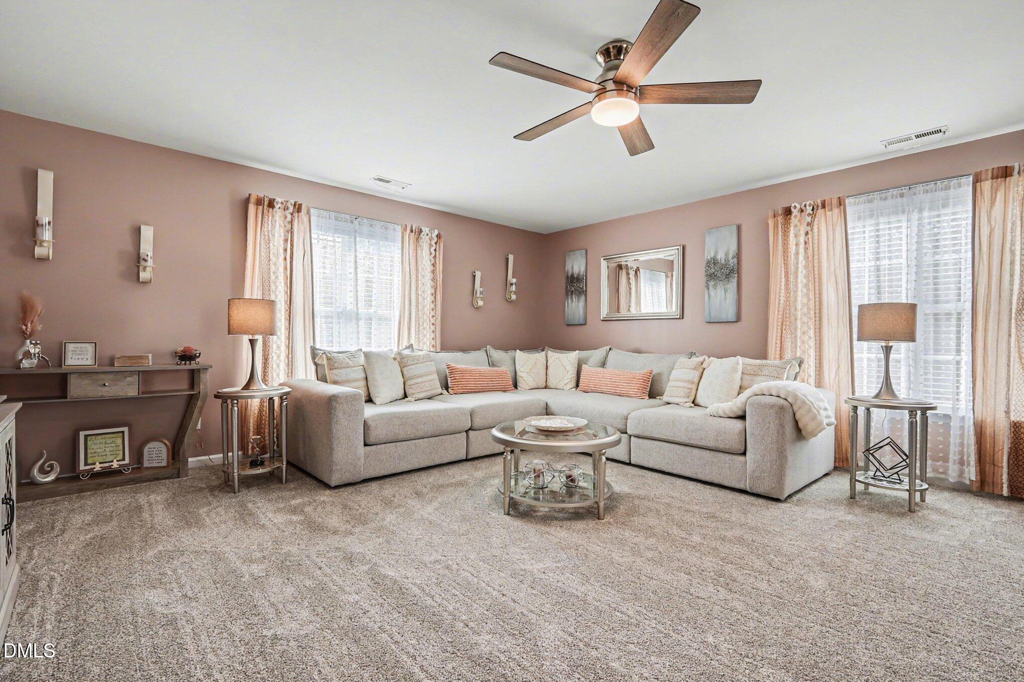 313 Blaze Ridge Drive Smithfield, NC 27577 - Photo 15 of 30 a living room with furniture and a large window