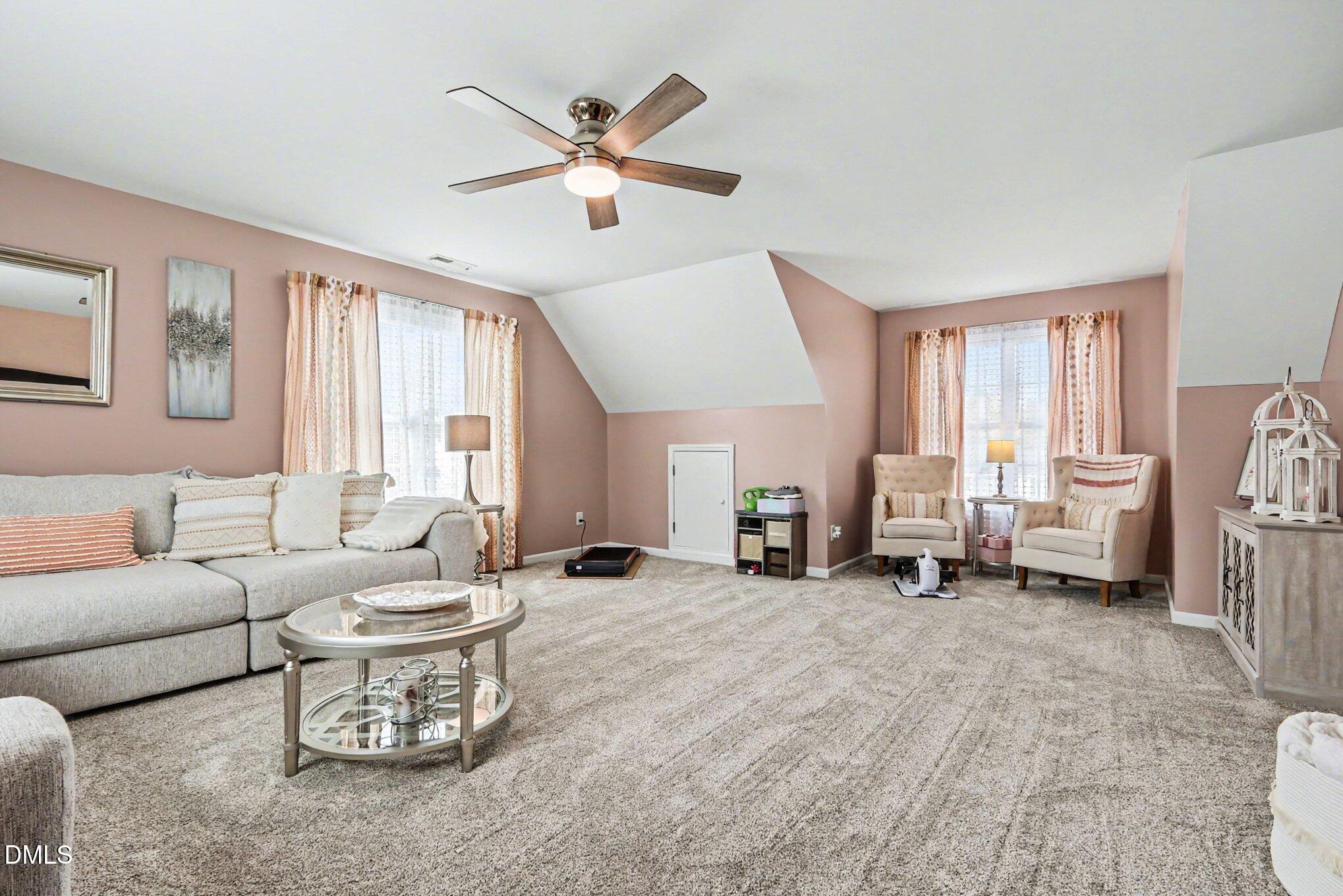 313 Blaze Ridge Drive Smithfield, NC 27577 - Photo 19 of 30 a living room with furniture and a large window