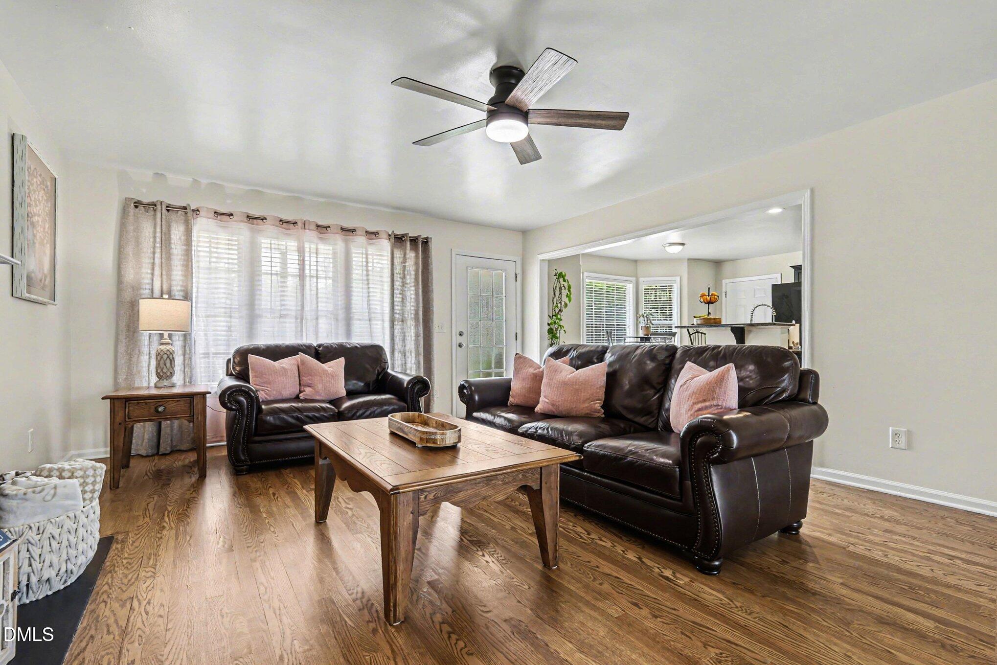 313 Blaze Ridge Drive Smithfield, NC 27577 - Photo 6 of 30 a living room with furniture and a wooden floor