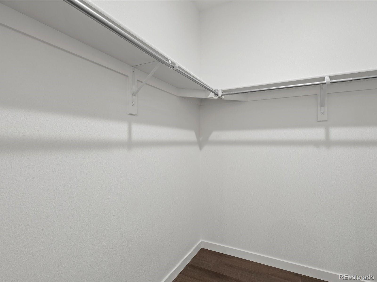 6153 North Ceylon Street, Unit 304 Denver, CO 80249 - Photo 12 of 14 a view of a room with shelf on the wall