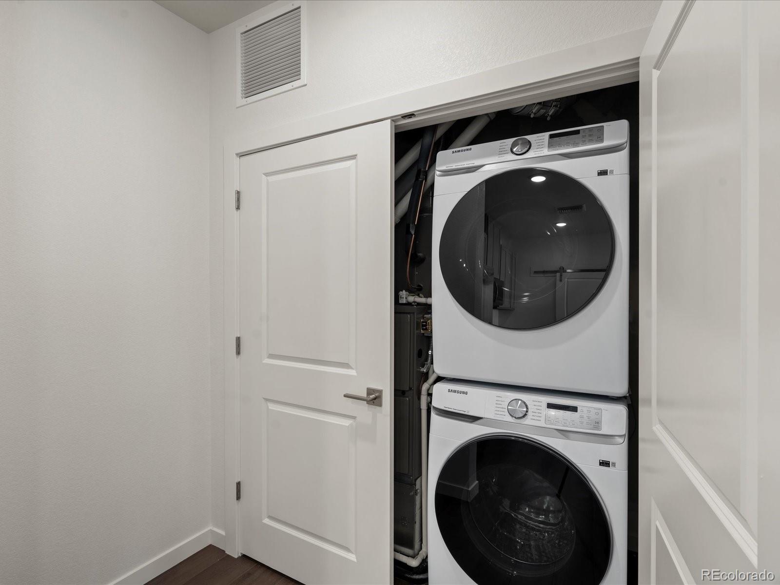 6153 North Ceylon Street, Unit 304 Denver, CO 80249 - Photo 6 of 14 a utility room with dryer and washer