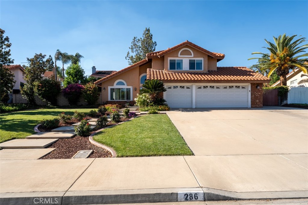 286 Bathurst Road Riverside, CA 92506 - Photo 1 of 1 a front view of a house with a yard