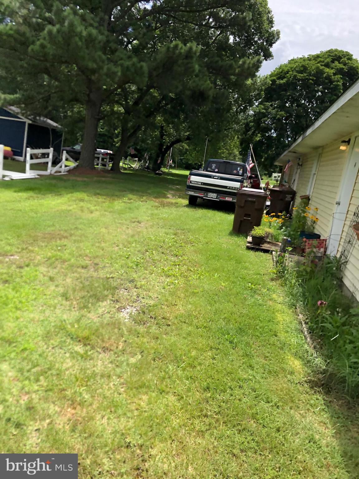 25548 Hill Road Greensboro, MD 21639 - Photo 11 of 11 a view of a house with a yard and sitting area