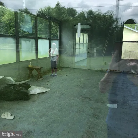 a backyard of a house with outdoor seating