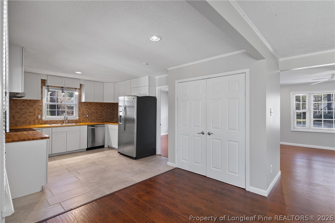 400 Hallmark Road Fayetteville, NC 28303 - Photo 11 of 37 a kitchen with stainless steel appliances a refrigerator and a stove top oven