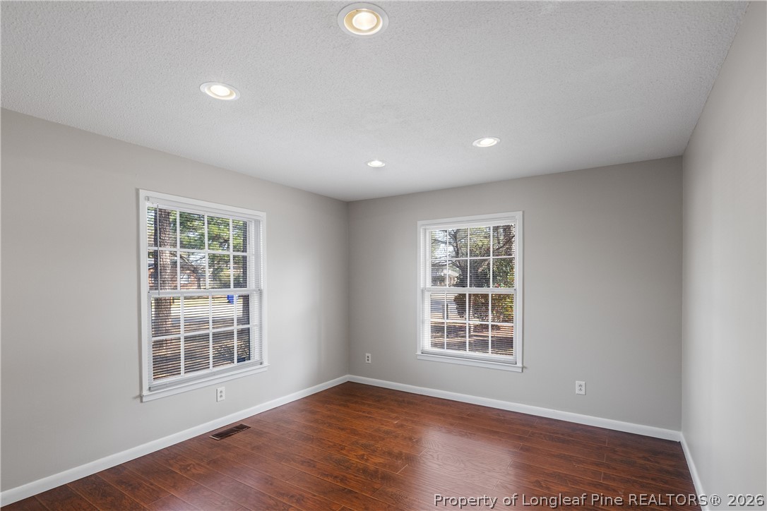 400 Hallmark Road Fayetteville, NC 28303 - Photo 13 of 37 a view of an empty room with wooden floor and a window