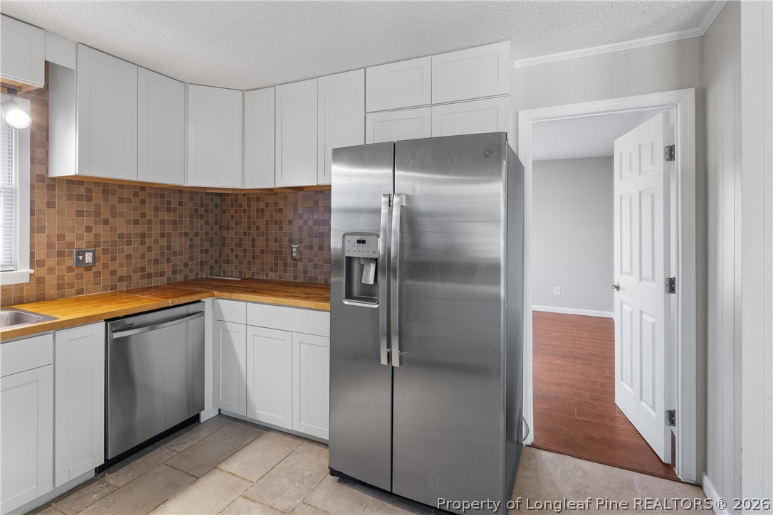 400 Hallmark Road Fayetteville, NC 28303 - Photo 17 of 37 a kitchen with stainless steel appliances granite countertop a refrigerator and a sink