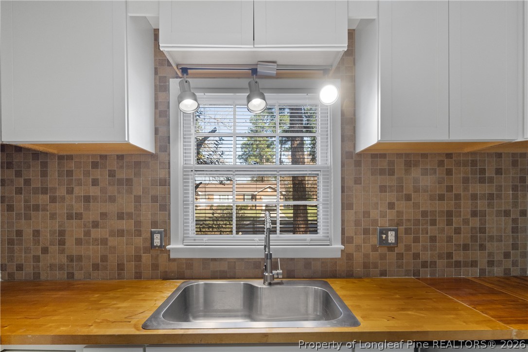 400 Hallmark Road Fayetteville, NC 28303 - Photo 18 of 37 a bathroom with a sink a bathtub and window