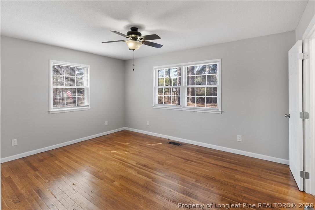 400 Hallmark Road Fayetteville, NC 28303 - Photo 20 of 37 a view of an empty room with wooden floor and a window