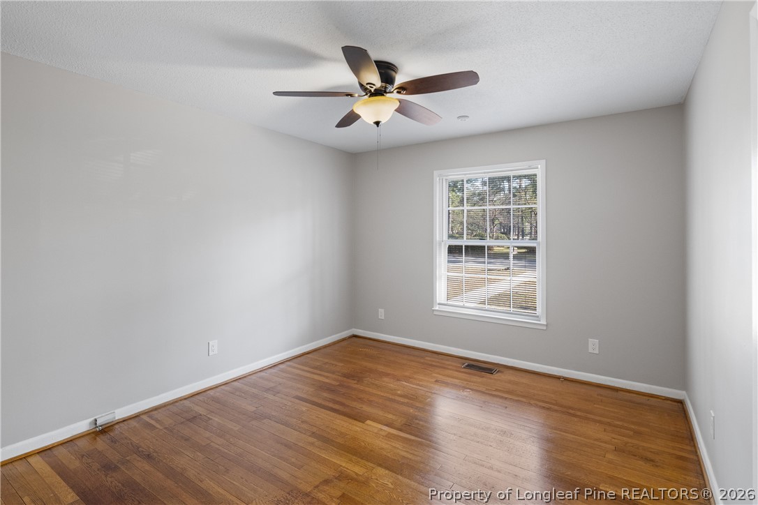 400 Hallmark Road Fayetteville, NC 28303 - Photo 27 of 37 a view of an empty room with wooden floor and a window