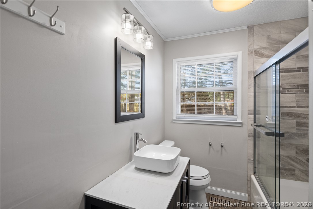 400 Hallmark Road Fayetteville, NC 28303 - Photo 30 of 37 a bathroom with a toilet sink and shower