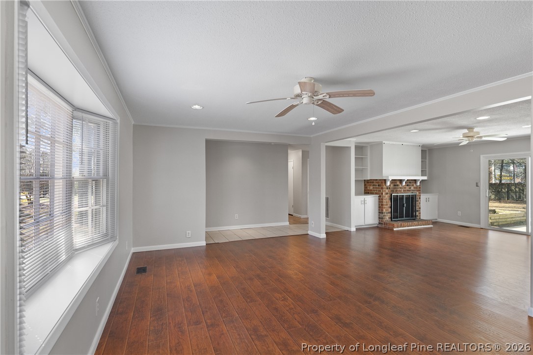 400 Hallmark Road Fayetteville, NC 28303 - Photo 5 of 37 a view of an empty room with wooden floor and a window