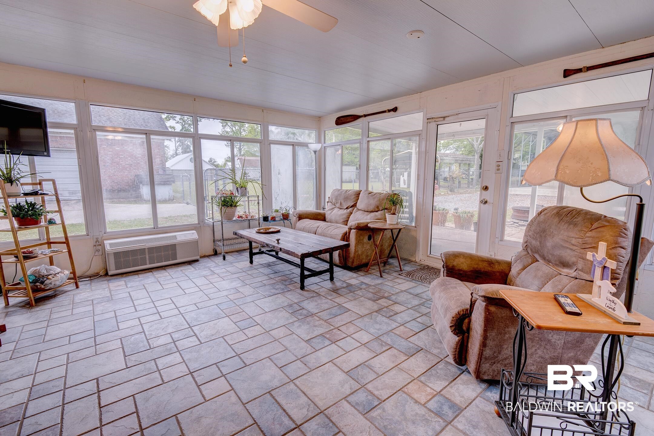 10093 Willis Road Foley, AL 36535 - Photo 24 of 33 Sunroom / solarium featuring stone tile floors and french doors