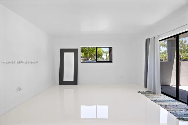 an empty room with windows