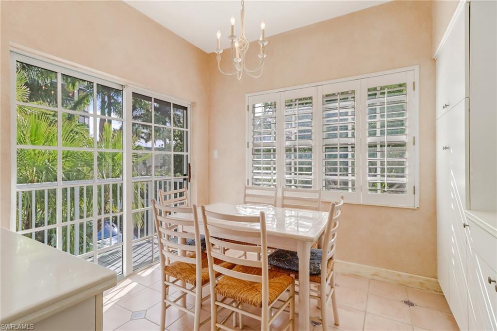 74 Seagate Drive, Unit 4 Naples, FL 34103 - Photo 12 of 35 a view of a dining room with furniture window and outside view