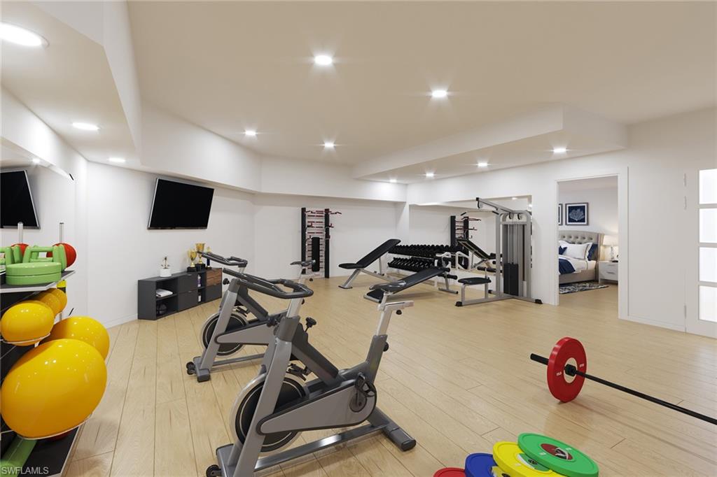 74 Seagate Drive, Unit 4 Naples, FL 34103 - Photo 28 of 35 a view of a room with gym equipment