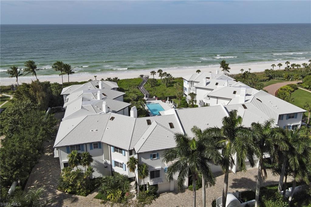 74 Seagate Drive, Unit 4 Naples, FL 34103 - Photo 32 of 35 an aerial view of residential houses with outdoor space