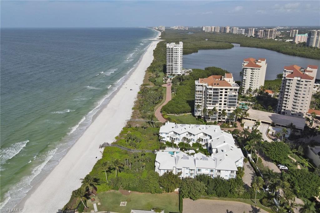 74 Seagate Drive, Unit 4 Naples, FL 34103 - Photo 35 of 35 a view of a city and an ocean view