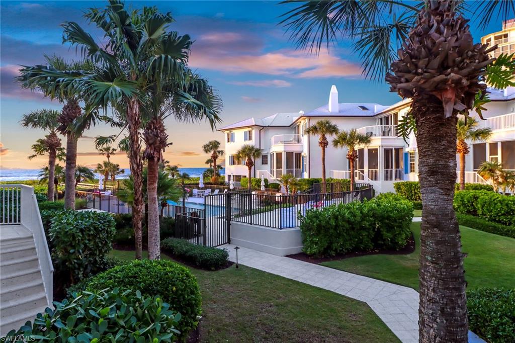 74 Seagate Drive, Unit 4 Naples, FL 34103 - Photo 6 of 35 a view of a palm trees in front of a house