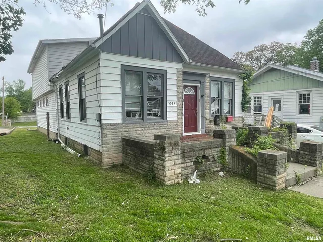 front view of a house with a yard