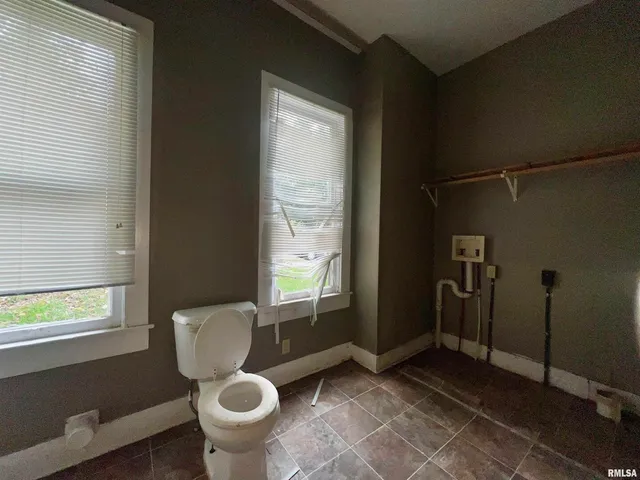 a kitchen with stainless steel appliances granite countertop a refrigerator and a stove