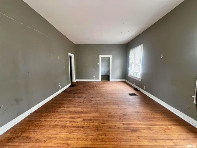 a view of an empty room and window