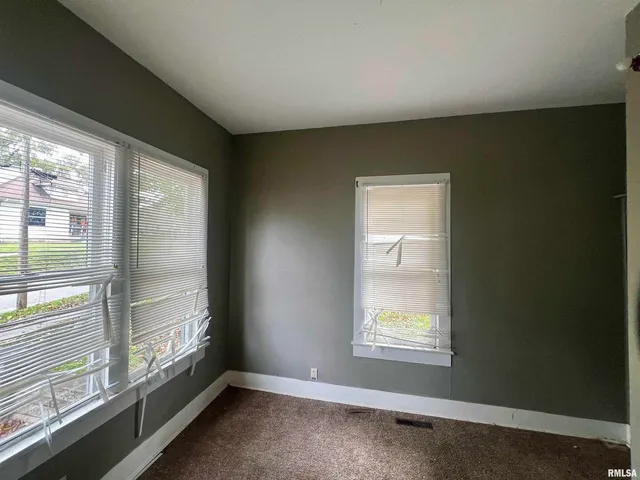 a kitchen with a stove and a refrigerator