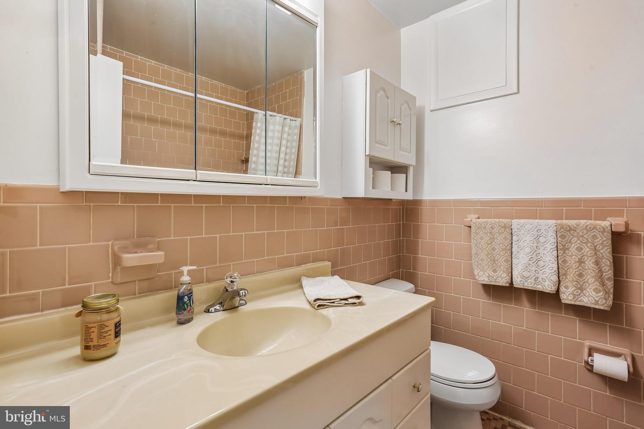 2 Foxhall Court Silver Spring, MD 20906 - Photo 42 of 86 a bathroom with a sink toilet and mirror