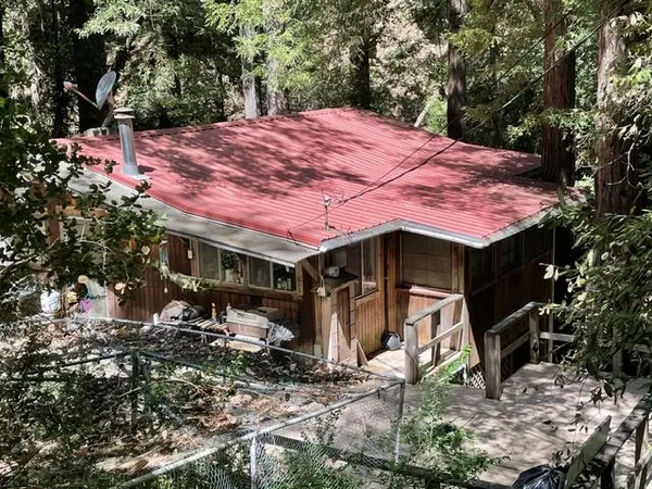 a view of house with backyard space and garden